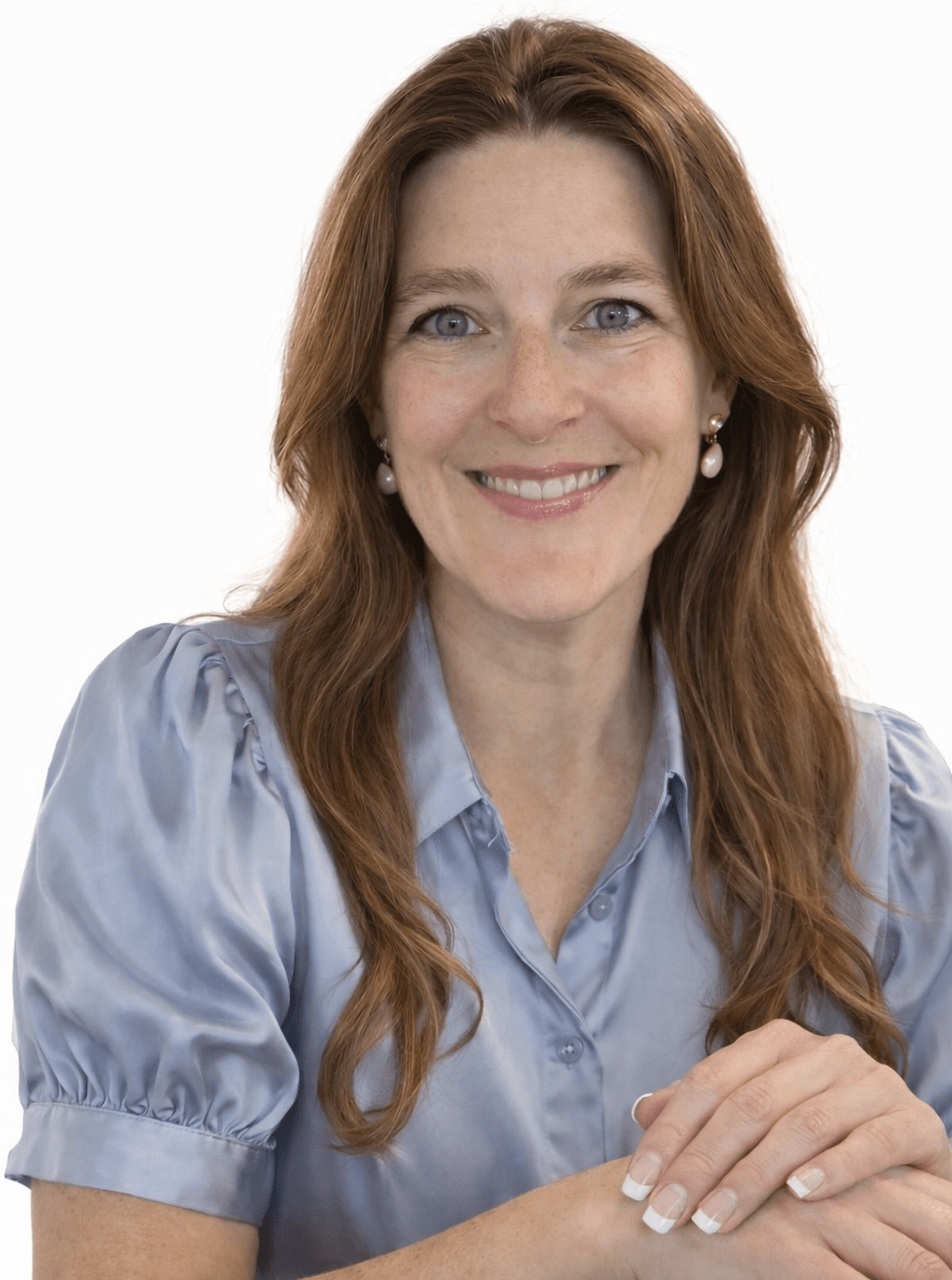 Jenna Bannister, AI automation expert for small business owners, working at her desk